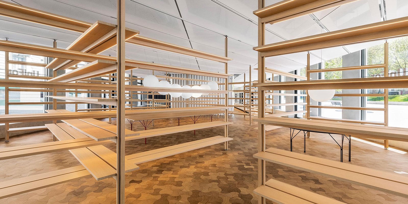 unifor-xyz-foster-sistema-librerie-scaffalature-biblioteche-installazione-interna-showroom-milano-fb